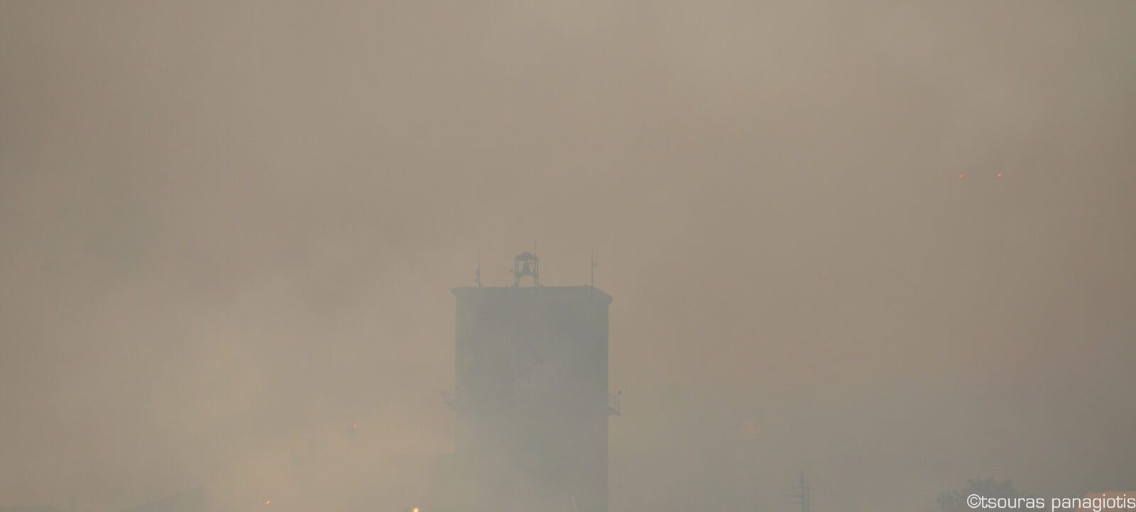 Levadia City Clock with War Siren into the smoke....