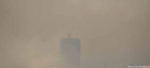 Levadia City Clock with War Siren into the smoke....